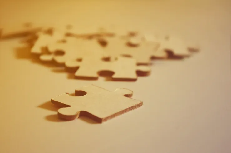 A close up photo of some puzzle pieces to convey finding a fit or niche