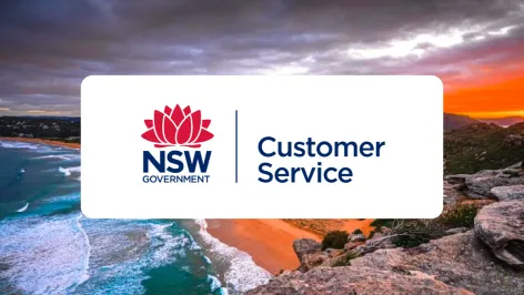 NSW Government Department of Customer Service logo with coastal background